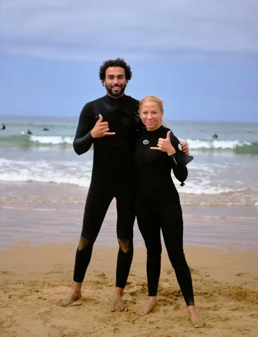 Olas surf instructor with a student